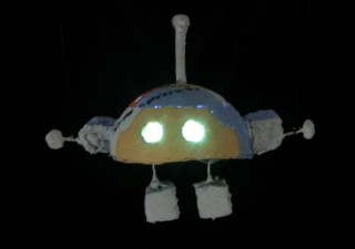 Robot from batteries not included movie 1987