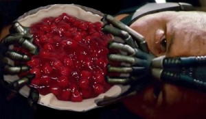 Tom Hardy as Bane in the Dark Knight Rises eating a Cherry Pie, looking like Goatse
